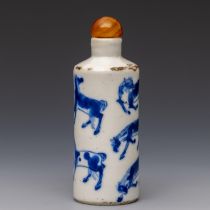 China, a blue and white and iron-red porcelain 'eight horses' snuff bottle and stopper, 19th century