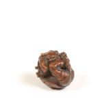 Japan, boxwood netsuke 'oni hiding under hat during Setsubun', Edo period, (1615-1868);