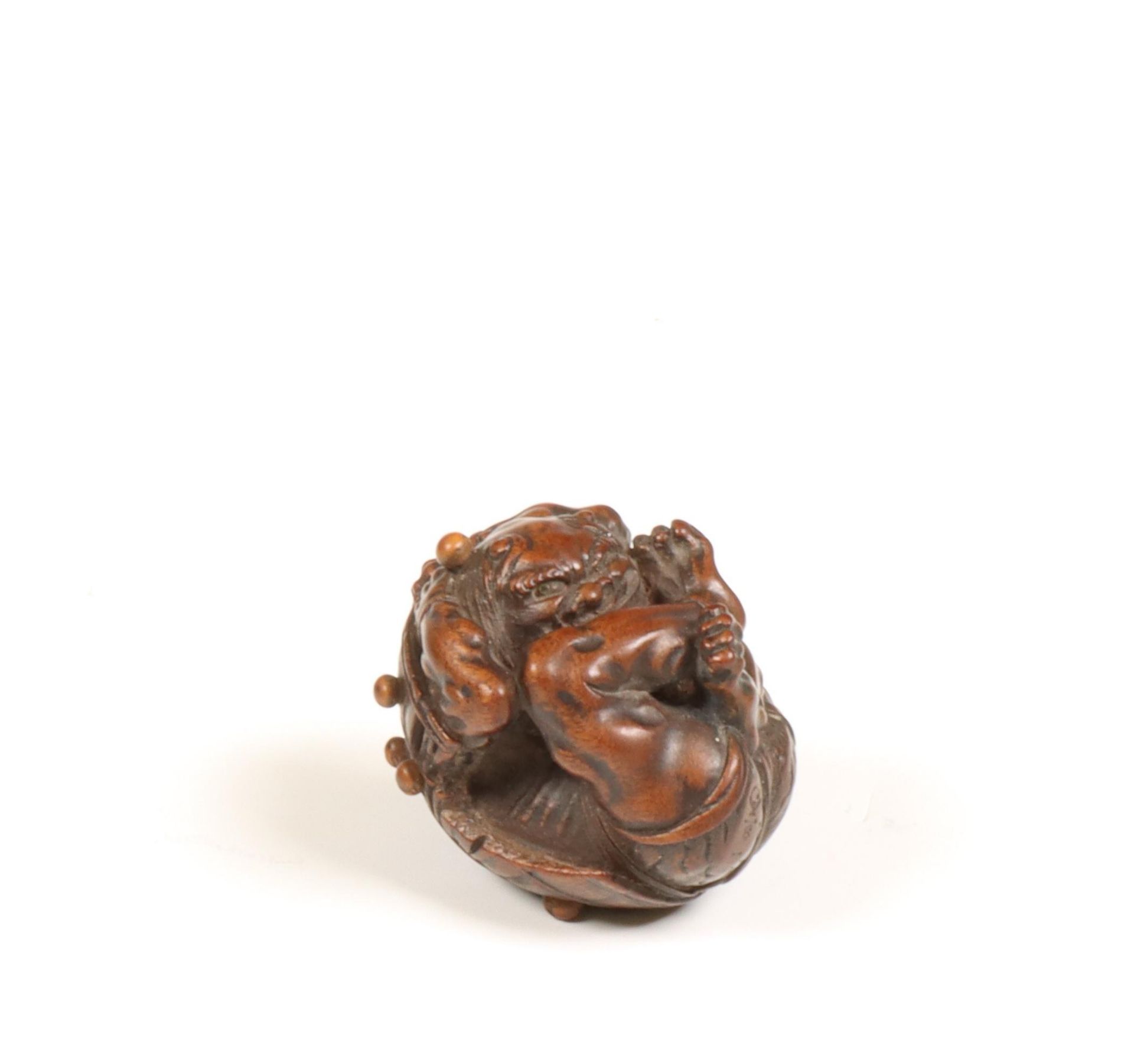 Japan, boxwood netsuke 'oni hiding under hat during Setsubun', Edo period, (1615-1868);