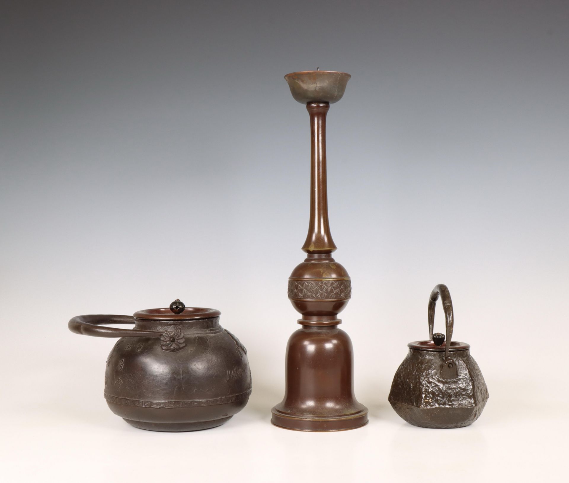 Japan, two iron kettles and a bronze candlestick, 20th century, - Image 4 of 4