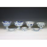 Japan, a collection of blue and white porcelain sake-cup washers and holders, 20th century,