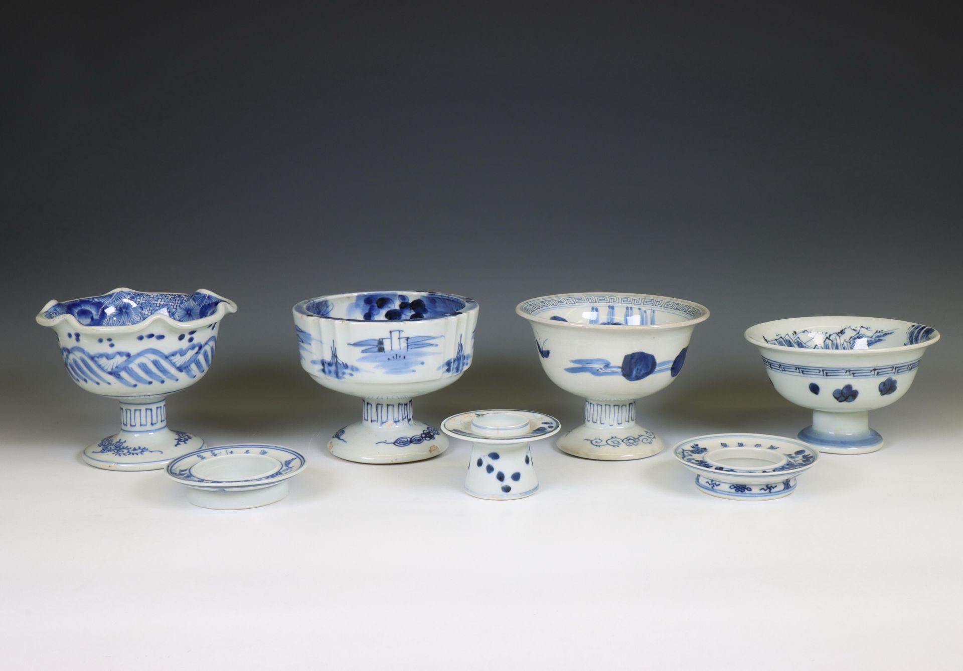 Japan, a collection of blue and white porcelain sake-cup washers and holders, 20th century,