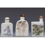 China, three polychrome decorated porcelain figural snuff bottles and stoppers, late Qing dynasty (1