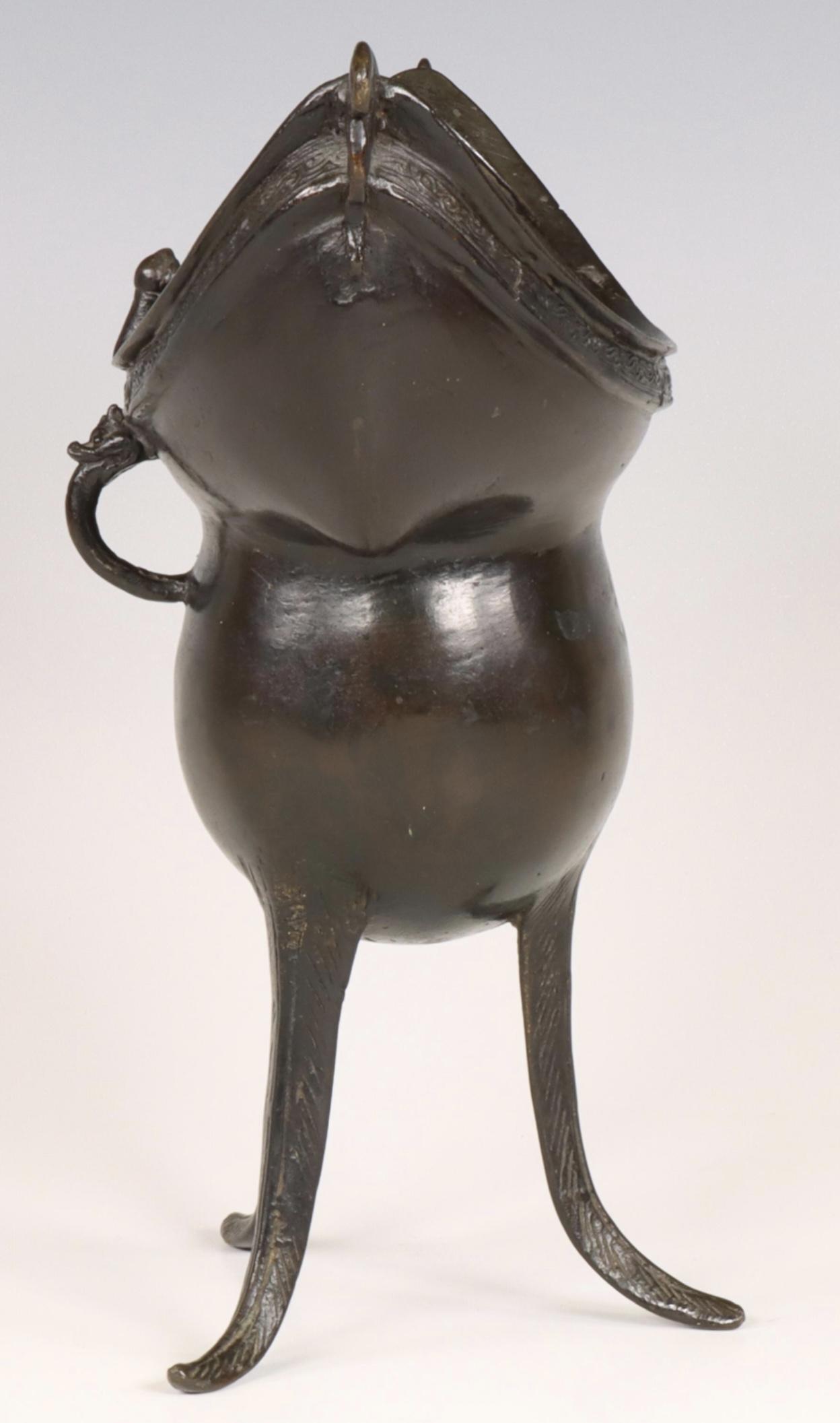 China, a bronze tripod ritual wine vessel, yue, Yuan or early Ming dynasty, 14th/ 15th century, - Image 4 of 5