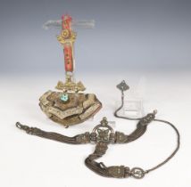 Tibet, a silver fire stone pouch and a silver alloy belt, ca. 1930;