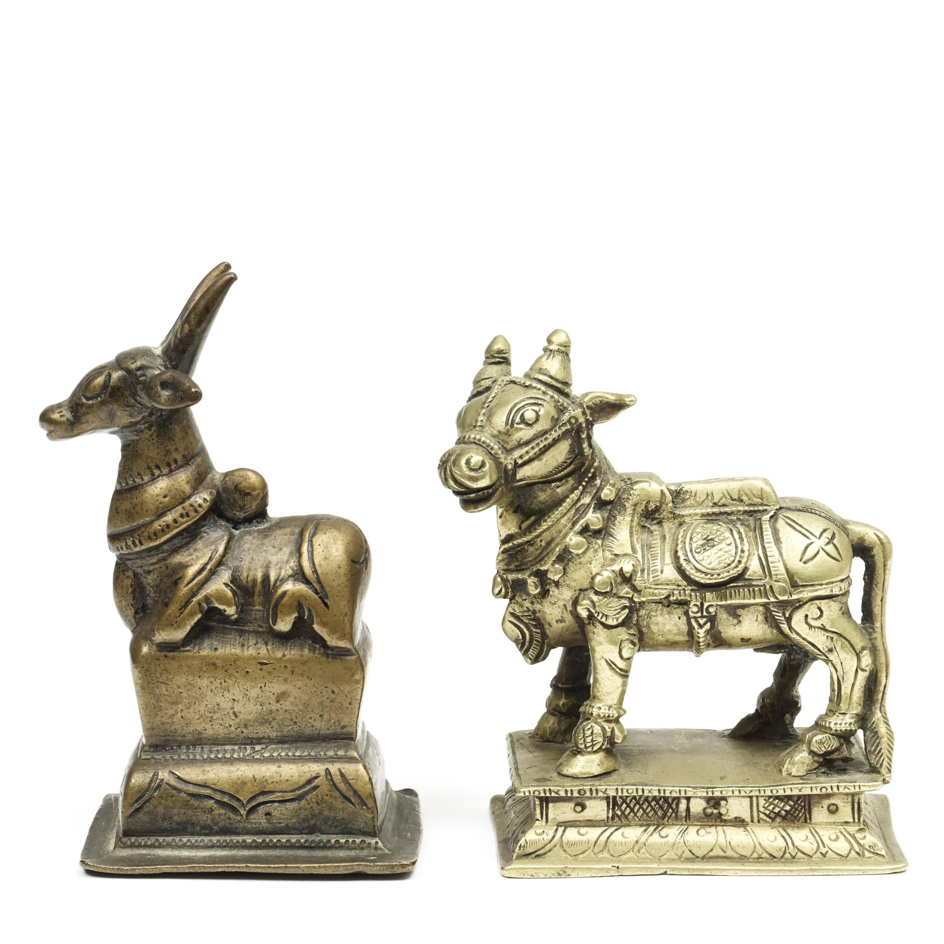 Noord-India, two bronze Nandi figures, 19th century;