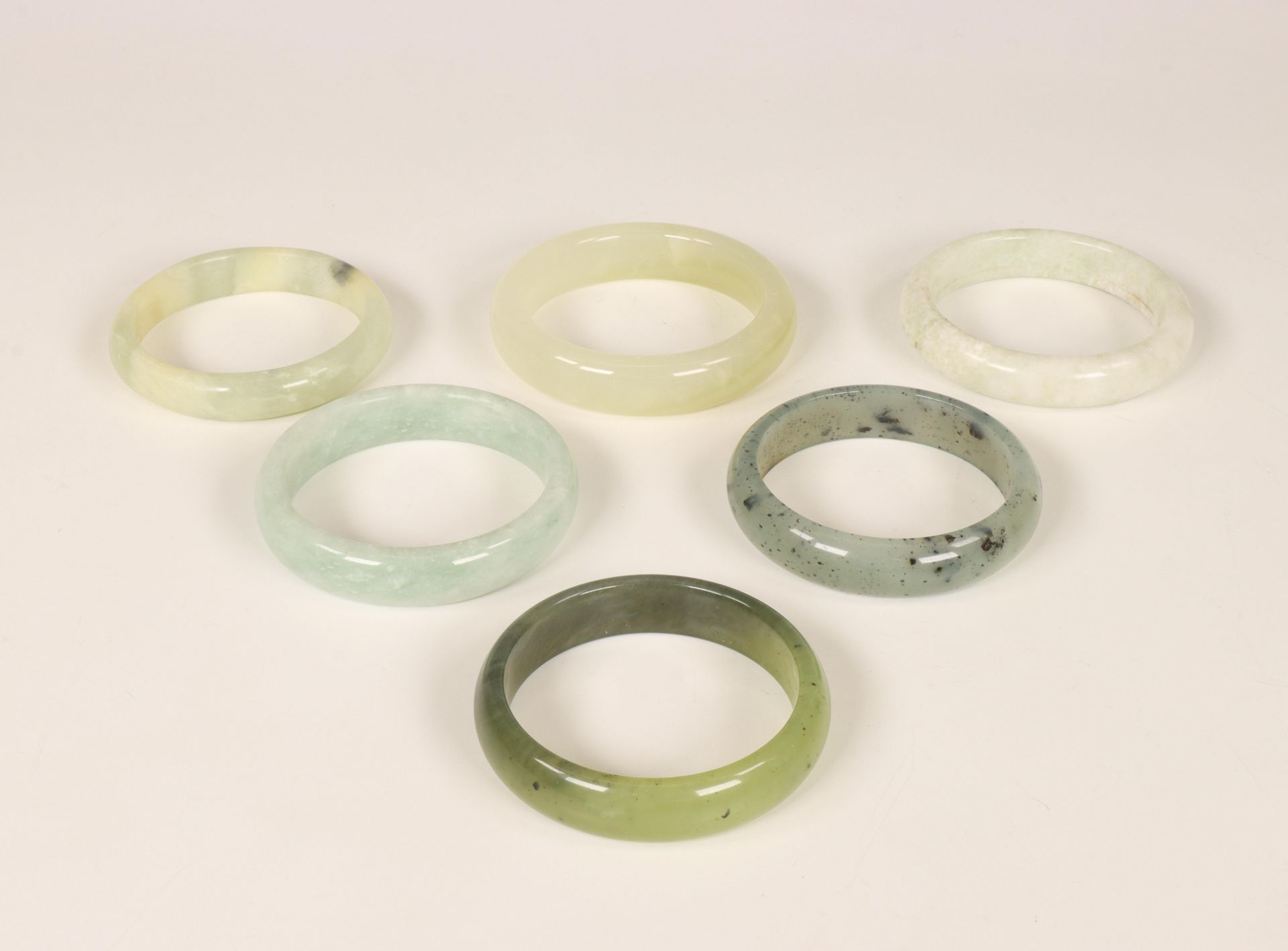 China, six various jade, jadeite and stone bracelets, modern,