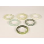 China, six various jade, jadeite and stone bracelets, modern,