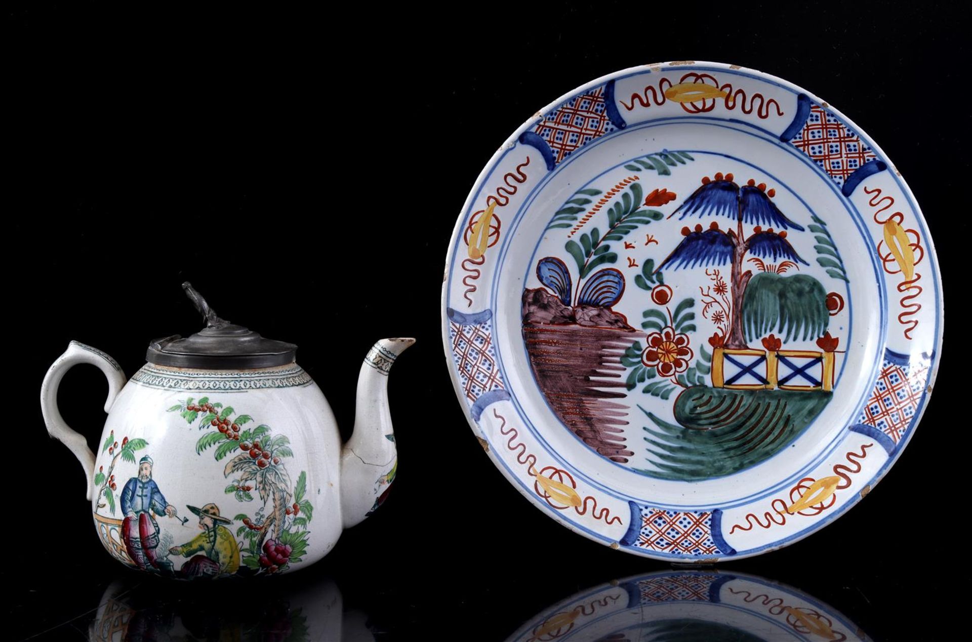 Earthenware teapot and Delft earthenware saucer