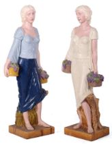 2 polychrome colored plastic statues