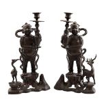 2 bronze candlesticks