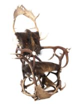 Armchair made of antlers and fur