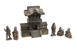 Metal pagoda with 5 oriental figures