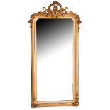 Mirror in gold-colored, richly carved wooden with plaster frame