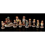 11 porcelain Hummel statues