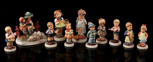 11 porcelain Hummel statues