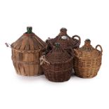 Lot glass wine bottles in wicker baskets