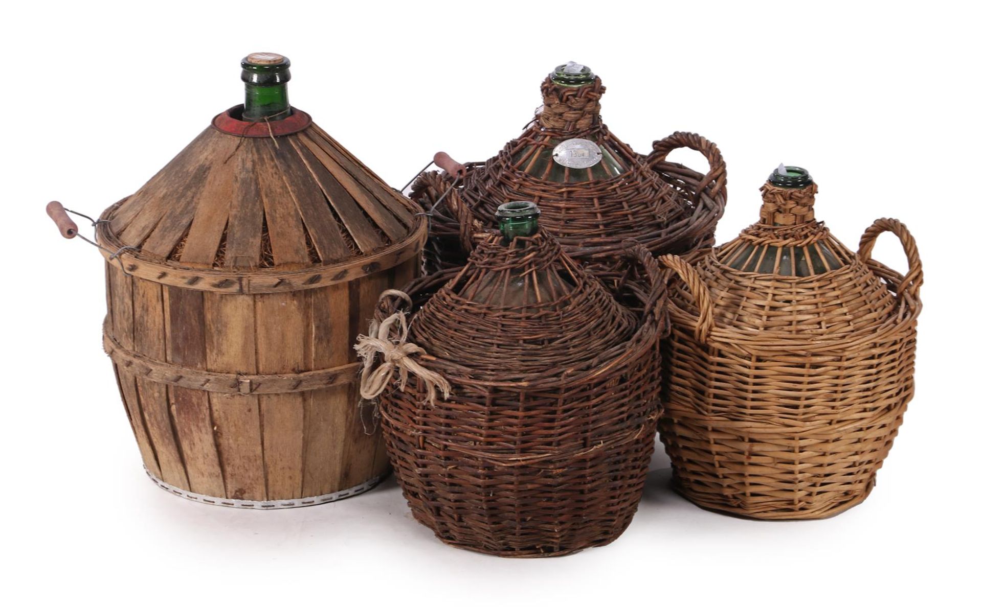 Lot glass wine bottles in wicker baskets