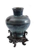 Earthenware vase on wooden base, 19th/20th