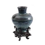 Earthenware vase on wooden base, 19th/20th