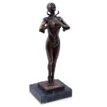 Bronze statue of a lady in a catsuit