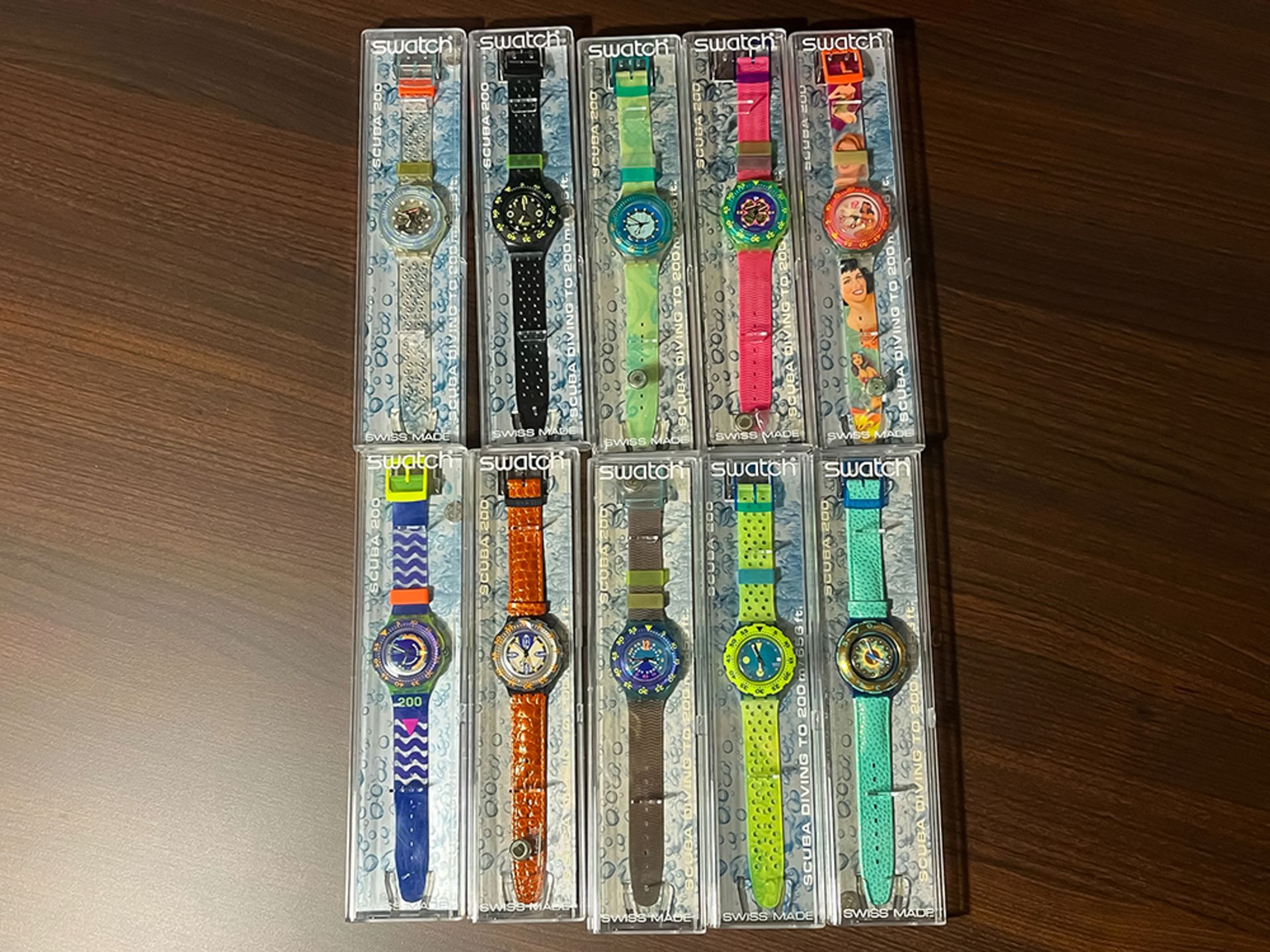 Collection of 105 pieces Swatch watches in original boxes