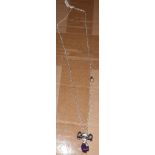 X 25 BRAND NEW SILVER NECKLACES WITH PURPLE CHARM - SALEROOM AT THE BOTTOM OF ROW (C).