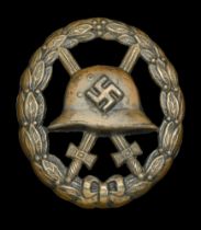 A M.1936 Spanish Civil War Wound Badge in Black with Fretted-out Swords. A very good qualit...