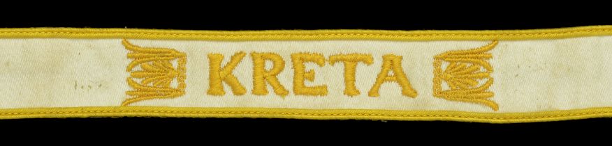 A 'Kreta' Cuffband. White cotton, with bright gold coloured cotton machine woven lettering,...
