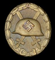 A German Second World War Wound Badge in Gold. Maker marked 'L14' in raised relief on the r...