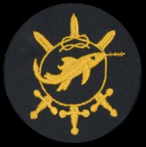 A Kriegsmarine Frogman's Combat Badge, Fourth Grade. Blue felt with gold cotton swordfish i...