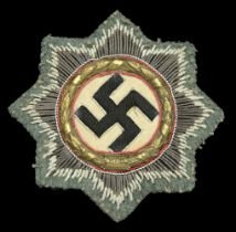 A German Cross in Gold. Army cloth version, on field grey backing material. A particularly...