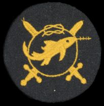 A Kriegsmarine Frogman's Combat Badge, Third Grade. Blue felt with gold cotton swordfish in...