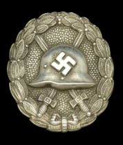 A M.1936 Spanish Civil War Wound Badge in Silver. A rare variation with a slightly curved w...