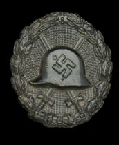 A M.1936 Spanish Civil War Wound Badge in Black. An exceptional quality example, retaining...