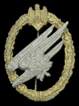 An Army Parachutist's Badge. Aluminium type, with anodised gold wreath and silvered diving...