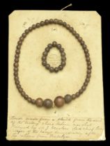 Beads made from the deck of H.M.S. Victory. An old card, 200mm x 145mm, with 2 rows of wood...