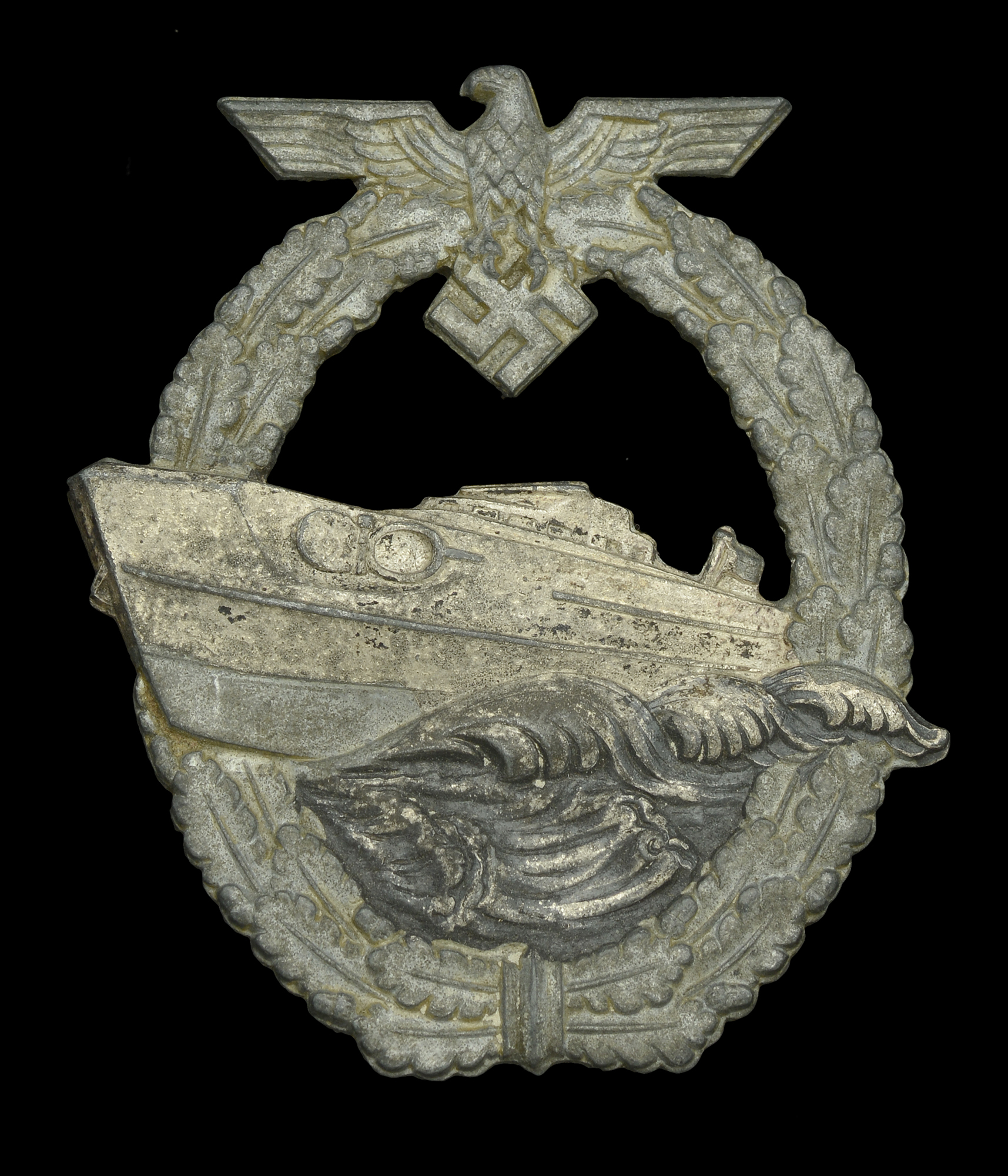 A German Second World War Kriegsmarine E-Boat Badge. A 2nd pattern E-Boat badge by Schwerin...