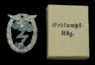 A Luftwaffe Ground Combat Badge in its Original Presentation Box. A mid-War zinc one piece...