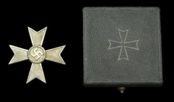 A War Service Cross First Class in Presentation Case. The Cross is in mint as new unissued...