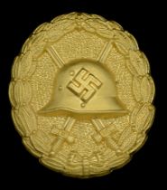 A M.1936 Spanish Civil War Wound Badge in Gold, Screw-back Version. A hollow back example,...
