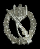 A German Second World War Infantry Assault Badge. An unusual example with half scooped reve...