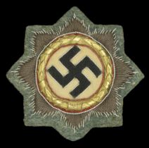 A German Second World War Cloth German Cross in Gold. A nice example of the cloth version o...