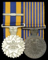 An Australian Forces pair awarded to Warrant Officer K. H. W. Willert, Royal Australian Army...