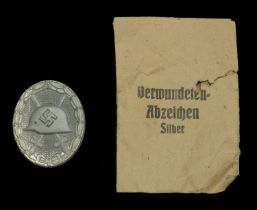A 1939 Silver Wound Badge in Presentation Packet. A late War type in original factory new c...