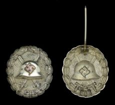 A M.1936 Spanish Civil War Wound Badge in Silver. A hollow back example, with round pin. Ve...