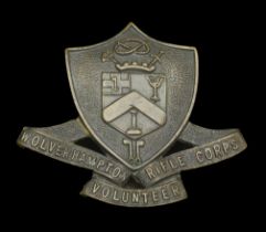 A Wolverhampton Volunteer Rifle Corps Cap Badge. A scarce example, the bronze arms of Wolve...