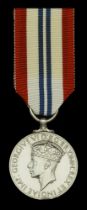 King's Medal for Courage in the Cause of Freedom, unnamed as issued, edge bruise, very fine...