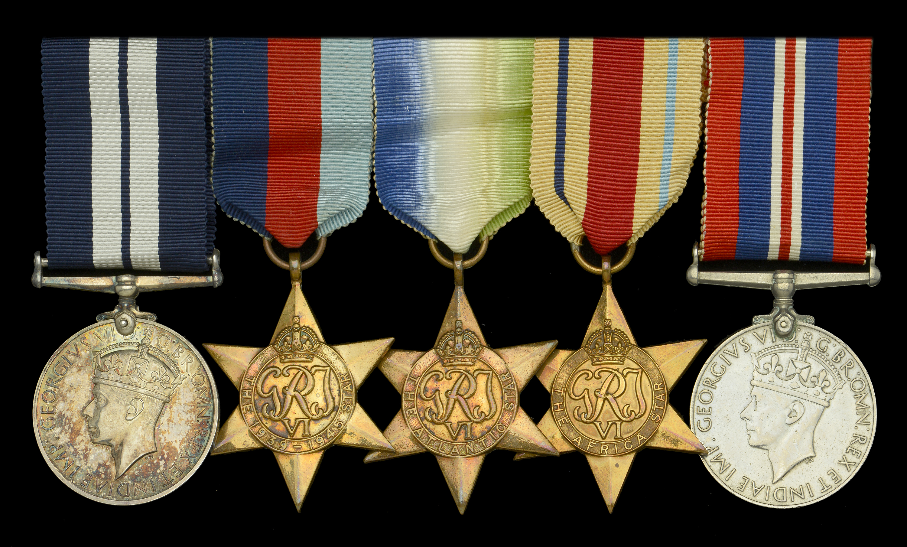 An outstanding Second War D.S.M. group of five awarded to Assistant Steward W. Barnett, for...