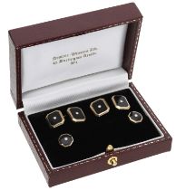 A pair of black enamel and diamond cufflinks, the rectangular panels each collet-set with a...